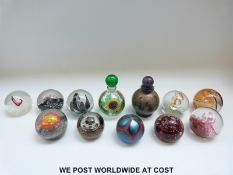 A collection of paperweights by Selkirk and Caithness including limited edition Sunflare (1239 /