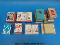 A collection of vintage playing cards including Animal Families