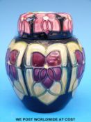 A Moorcroft ginger jar decorated in abstract violet design (12cm tall)