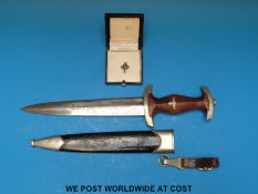 A WWII Nazi German SA dress dagger by Rudolf Schmidt, Solingen in scabbard with hangar,