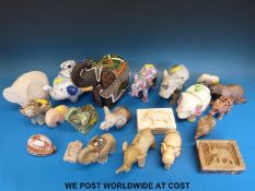 A collection of elephants of various sizes to include stone,
