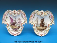 A pair of Lille shield shaped armorial plates hand decorated with harbour scenes