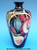 A Moorcroft vase decorated with exotic fruits and dated 2000 (15cm tall)