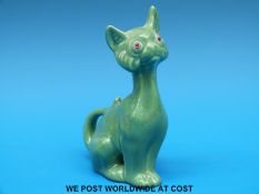 An Arts & Crafts ceramic cat with glass eyes