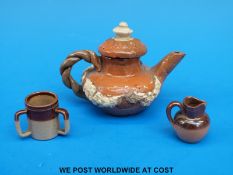 A miniature Doulton pottery set comprising teapot, jug etc.