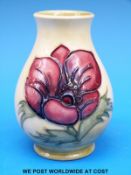 A Moorcroft pedestal bulbous vase decorated in the Anemone pattern (10cm tall)