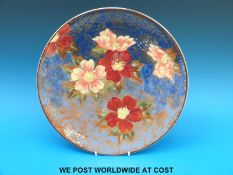 A Royal Doulton charger with wild rose design (34cm diameter)