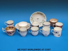 A collection of late 18th/19thC Derby and Imari porcelain cups and coffee cans