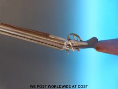 Unnamed 12 bore double barrelled side by side hammer action shotgun with engraving to the side