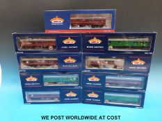 Nine Bachmann 00 gauge British Rail carriages in maroon and green liveries, all in original boxes.