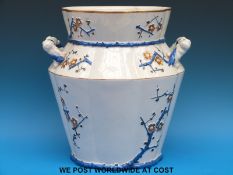 A Belleek large twin handled vase with relief decoration of flowers, probably aesthetic period,