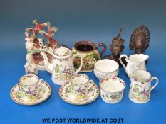 A 19thC Staffordshire bocage figure, pretty hand decorated tea for two, hard wood busts,