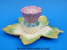 A Clarice Cliff candle holder in the form of a leaf