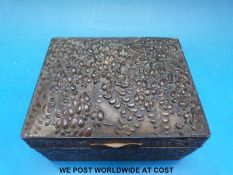 A Japanese box with raised foliate design