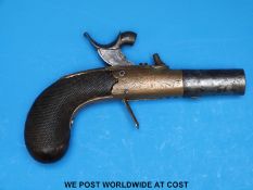 A hammer action brass framed percussion pocket pistol with ornate engraving, chequered grip,