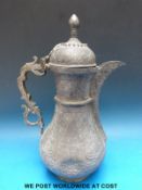 A late 19th /early 20thC Afghan pewter dallah ornately chased across the base,