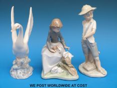 Nao figures including a child with catapult,