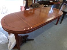 A Chinese elm dining table and ten chairs,