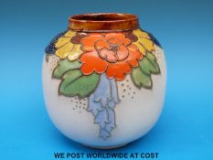 A Royal Doulton globular vase with tube lined floral decoration (21cm tall)