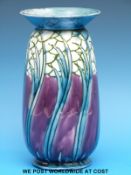 A Minton secessionist vase decorated with stylised trees in purple