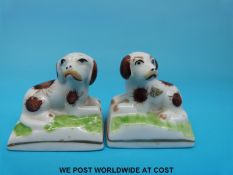 A pair of 18thC /19thC porcelain spaniels