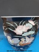 A large Chinese famille noir fish bowl/ jardiniere (35.