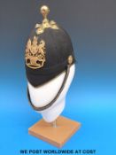A Royal Artillery blue cloth Kings crown helmet