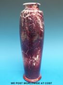 A Ruskin vase of slender shouldered form in Sang de Boeuf glaze (25.