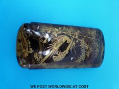 A Japanese tortoiseshell cigar case decorated in gilt,