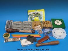 A box of fishing flies including salmon, sea trout and trout, leather and wooden priests,