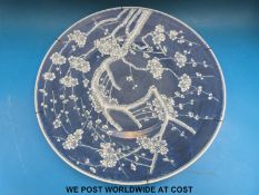 19thC Chinese charger decorated with prunus flowers on blue ground (47cm in diameter)