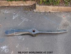 A laminated wood aircraft propeller with metal leading edges (length 180cm)