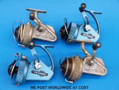 Four vintage fixed spool fishing reels including two Ambidex casting reels and two Delmatic Six
