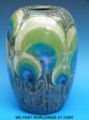 A large Dartington pottery vase with peacock feather design (29cm tall)