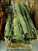 Approximately 20 military style camp beds