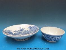 A 19thC Chinese blue and white slop bowl bearing the Kangxi mark and a plate