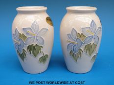 A pair of Moorcroft urn shaped vases decorated in the Anemone pattern (10.