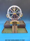 A scratch built WWII prisoner of war clockwork wooden fairground ferris wheel,