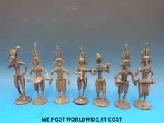 Seven Ashanti tribe gold weights all in the form of figures playing musical instruments (15cm tall)
