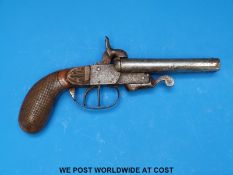 A double barrelled side by side hammer action pin fire percussion pistol with carved and chequered