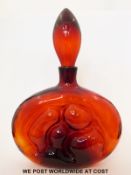 Wayne Husted for Blenko red glass decanter of flattened form with moulded design (34cm tall)