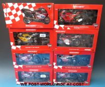 Eight Minichamps 1:12 scale diecast model Ducati course superbikes all in original boxes