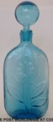 Empoli moulded blue glass decanter of flattened form with flower design (36.