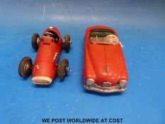 Two Schuco clockwork tin plate cars,