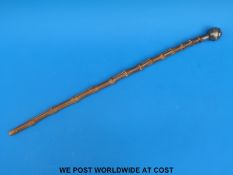 A hallmarked silver topped Gold Coast Police swagger stick (length 54cm)