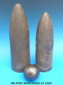 Two brass shell covers (maximum height 38cm) and an 8.