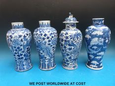 A pair of Chinese blue and white vases decorated with foliage and birds,