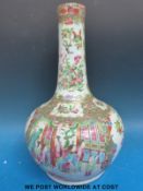 A large 19thC Chinese Cantonese famille rose bottle vase decorated with typical figural/court