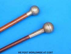 Two Gloucestershire Regiment military swagger sticks (length 70cm)
