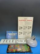 Six vintage glass 'Telephone' signs (length 64cm) and an 'Electric Shock' sign,